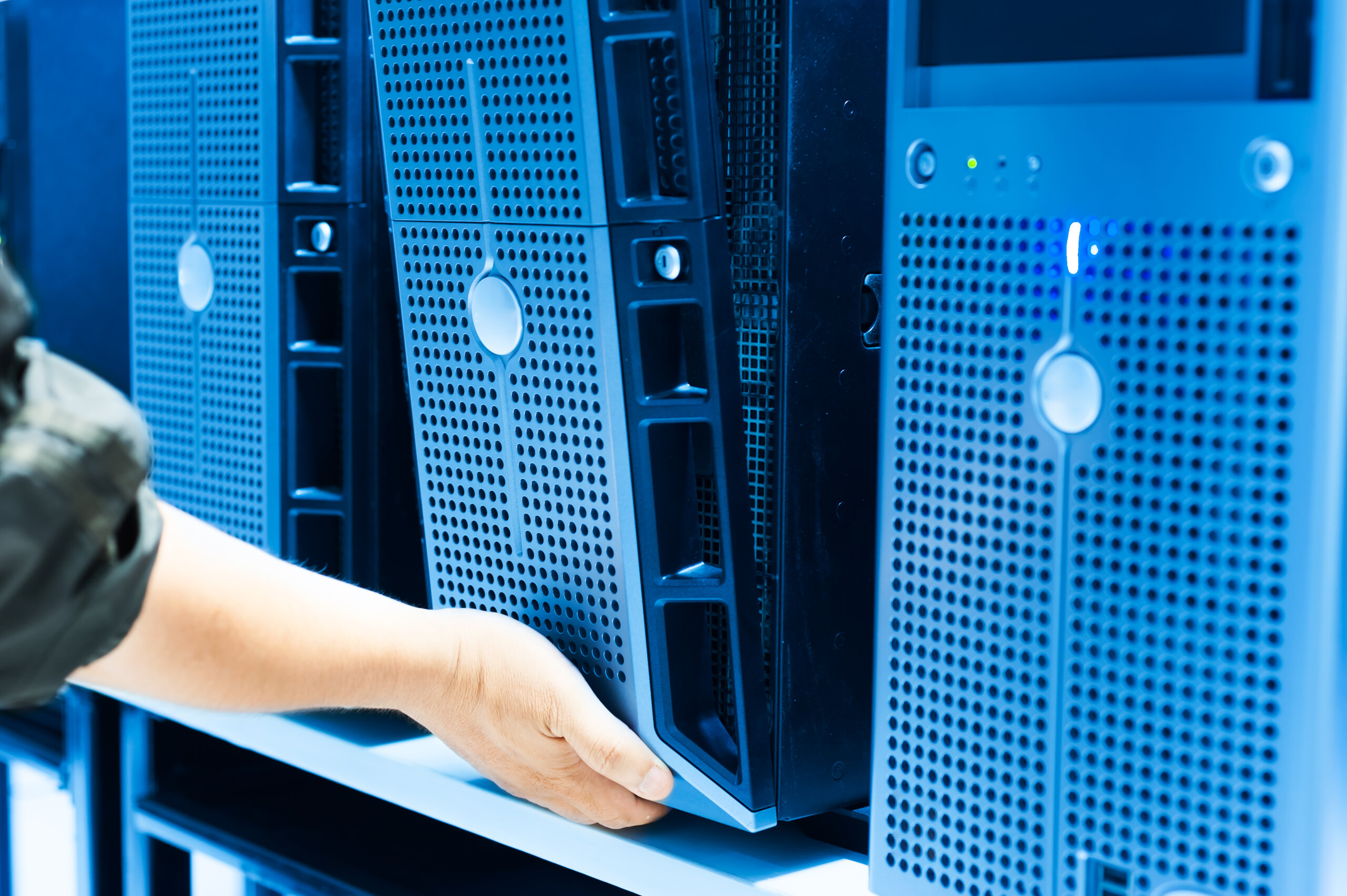 IT engineer repairing a server in a datacenter